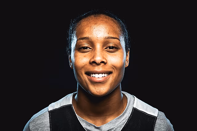 Smiling California Storm player in a studio portrait.