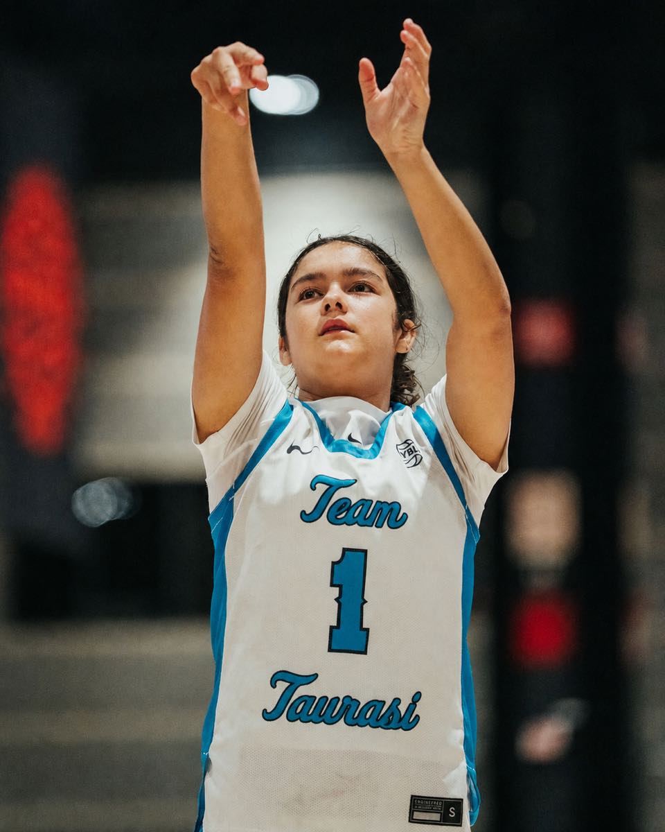 Team Taurasi player wearing number 1 holds her follow-through during a free throw