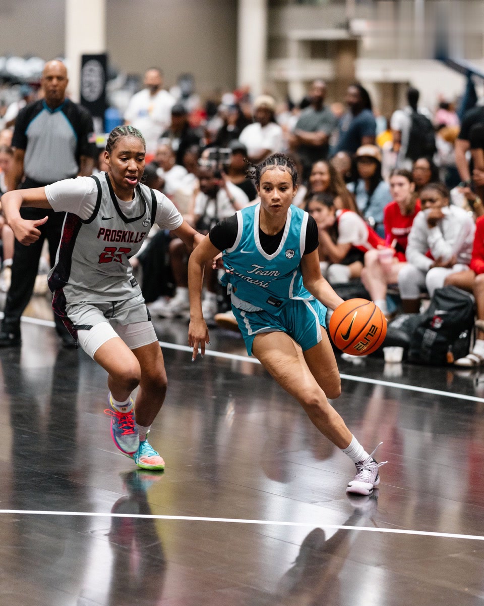 Team Taurasi ball-handler drives past a defender during Nike Nationals competition