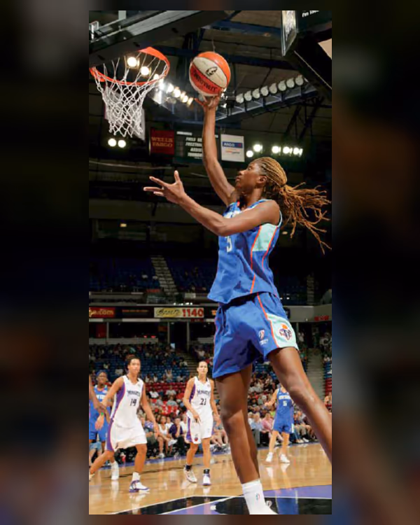 Iciss Tillis extends for a layup during WNBA competition.